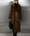 Long genuine brown mink fur coat with a luxurious satin lining, featuring a belted waist and elegant silhouette.