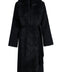 Black cashmere coat with voluminous fox fur collar, combining luxury materials and timeless design.