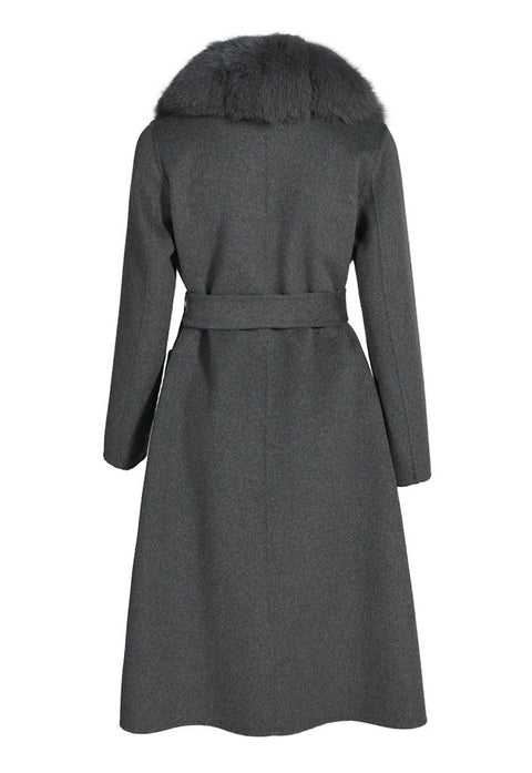 Structured grey cashmere coat with a flawless fit, waist-cinching belt, and cascading grey fox fur trim that enhances its timeless design.